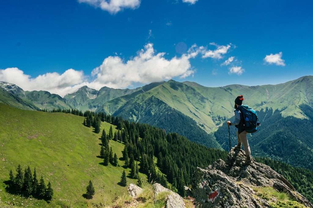 Man hiking on mountains for a healthy lifestyle