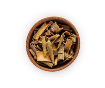 Willow bark in wooden Cup on white background white willow bark