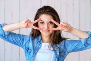 happy woman showing healthy eyes