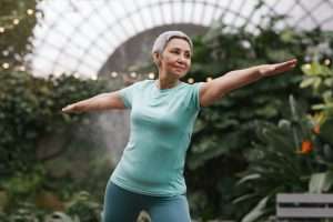 Fit woman stretching in park