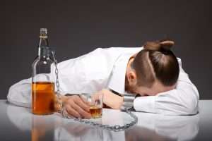 tired young businessman drinking 1